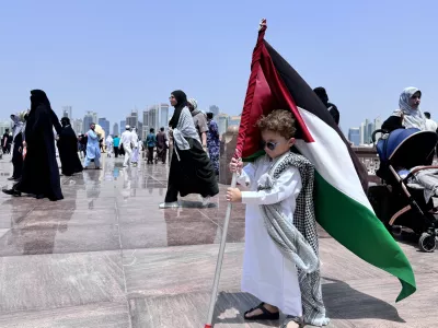 DOHA, QATAR - AUGUST 2: A child holds a Palestinian flag as people attend funeral ceremony, held for Hamas political chief Ismail Haniyeh, who was assassinated in Tehran, at Imam Abdul Wahhab Mosque in Doha, Qatar on August 2, 2024. Ali Altunkaya / AnadoluNo Use USA No use UK No use Canada No use France No use Japan No use Italy No use Australia No use Spain No use Belgium No use Korea No use South Africa No use Hong Kong No use New Zealand No use Turkey