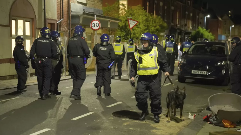 Police officers are deployed on the streets of Hartlepool, England, following a violent protest in the wake of the killing of three girls who were fatally stabbed in northwest England, Wednesday, July 31, 2024. (Owen Humphreys/PA via AP)