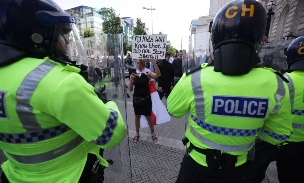 03 August 2024, United Kingdom, Liverpool: People protest in Liverpool, following the stabbing attacks on Monday in Southport, in which three young children were killed. Photo: James Speakman/PA Wire/dpa