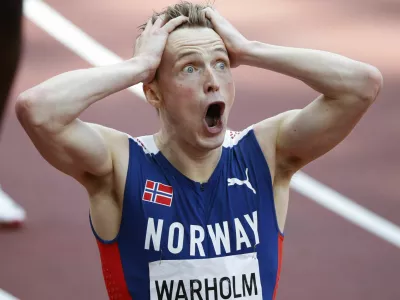 ﻿Tokyo 2020 Olympics - Athletics - Men's 400m Hurdles - Final - Olympic Stadium, Tokyo, Japan - August 3, 2021. Karsten Warholm of Norway reacts after realizing he had set a new world record. REUTERS/Phil Noble