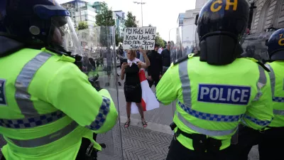 03 August 2024, United Kingdom, Liverpool: People protest in Liverpool, following the stabbing attacks on Monday in Southport, in which three young children were killed. Photo: James Speakman/PA Wire/dpa