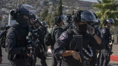 03 August 2024, Israel, Umm al-Fahm: Police officers stand guard as Israeli Arabs and left-wing Israelis take part in a protest against the war in Gaza and the escalation in Lebanon and Iran. Photo: Ilia Yefimovich/dpa