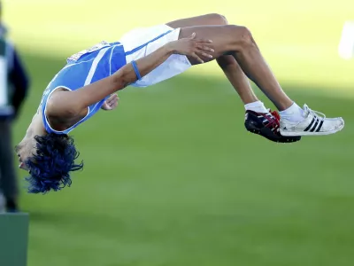 Gianmarco Tamberi of Italy performs a somersault during the men's high jump final at the European Athletics Championships in Helsinki June 29, 2012.  REUTERS/Yves Herman (FINLAND - Tags: SPORT ATHLETICS)