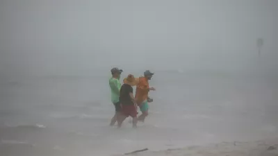 04 August 2024, US, Tampa: People venture into the shallows off the Dunedin Causeway, as a squall of storms inundates the area with wind and rain as Tropical Storm Debby passes the Tampa Bay area offshore. Photo: Douglas R. Clifford/Tampa Bay Times/ZUMA Press Wire/dpa