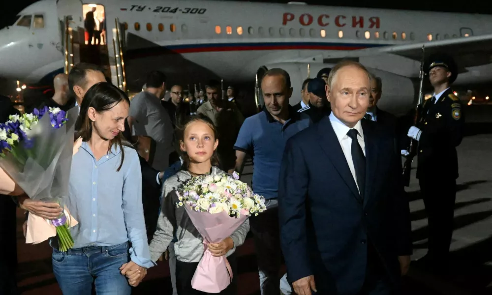 FILE PHOTO: Russian President Vladimir Putin welcomes Russian nationals, including Artyom Dultsev, Anna Dultseva and their children, following a prisoner exchange between Russia with Western countries, during a ceremony at Vnukovo International Airport in Moscow, Russia August 1, 2024. Sputnik/Mikhail Voskresensky/Pool via REUTERS ATTENTION EDITORS - THIS IMAGE WAS PROVIDED BY A THIRD PARTY./File Photo