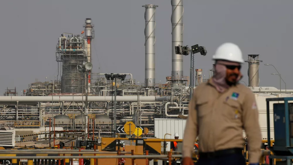 ﻿FILE PHOTO: An employee looks on at Saudi Aramco oil facility in Abqaiq, Saudi Arabia October 12, 2019. REUTERS/Maxim Shemetov//File Photo