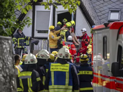 A person is rescued from the partially collapsed hotel in Kroev, Germany Wednesday, Aug. 7, 2024. (Harald Tittel/dpa via AP)