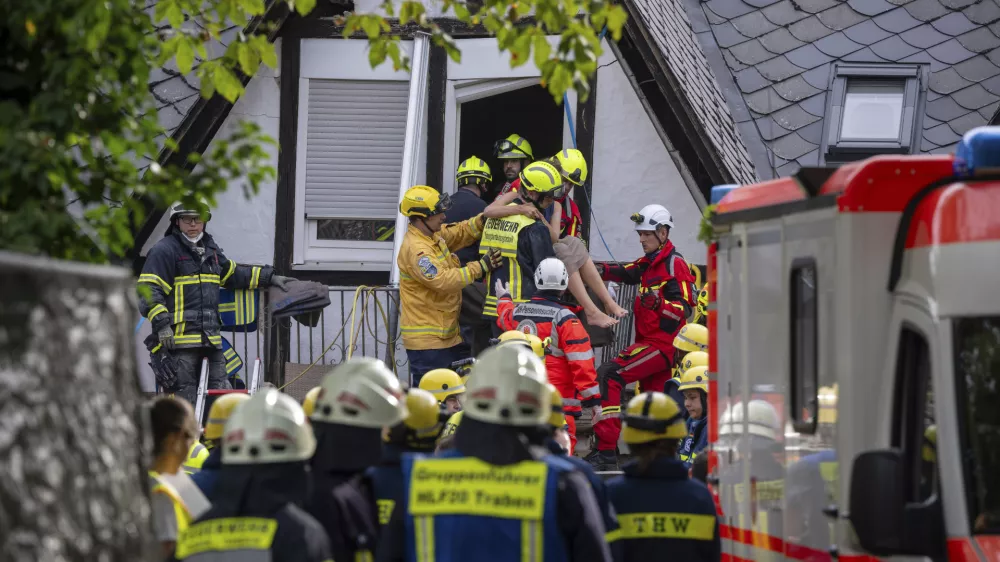 A person is rescued from the partially collapsed hotel in Kroev, Germany Wednesday, Aug. 7, 2024. (Harald Tittel/dpa via AP)