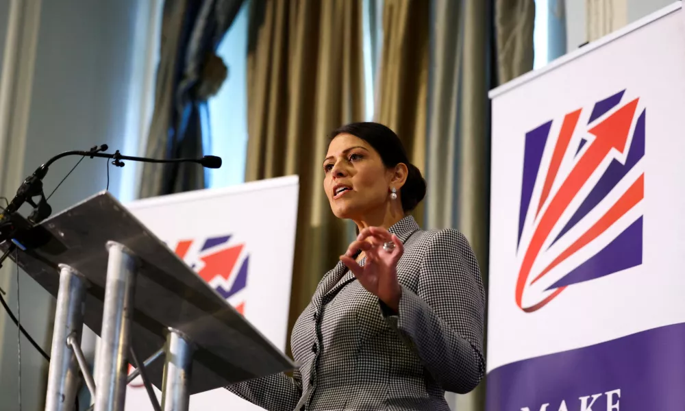 FILE PHOTO: Priti Patel speaks on stage at the Britain's Conservative Party's annual conference in Manchester, Britain, October 2, 2023. REUTERS/Hannah McKay/File Photo