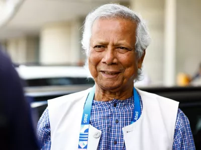 Nobel laureate Muhammad Yunus, who was recommended by Bangladeshi student leaders as the head of the interim government in Bangladesh, reacts at Paris Charles de Gaulle airport in Roissy-en-France, France August 7, 2024. REUTERS/Abdul Saboor