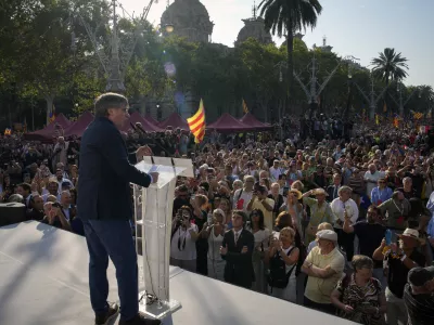 Catalan independence leader and former President Carles Puigdemont addresses supporters after his arrival near the Catalan parliament to attend the investiture debate in Barcelona, Spain, Thursday Aug. 8, 2024. Puigdemont, the former leader of Catalonia who left Spain after organizing an independence referendum in the Spanish northeastern region seven years ago, announced that he plans to return home on Thursday despite the likelihood of being arrested on his return. (AP Photo/Emilio Morenatti)