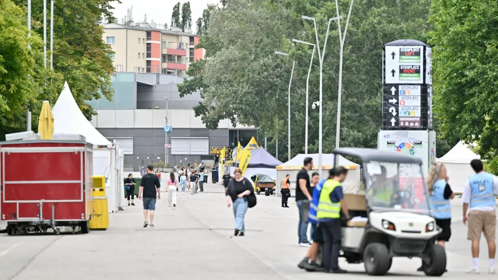 People and security walk outside Happel stadium after Taylor Swift's three concerts this week were canceled after the government confirmed a planned attack at the stadium in Vienna, Austria, August 8, 2024. REUTERS/Elisabeth Mandl