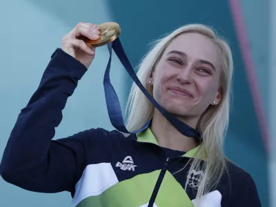 Paris 2024 Olympics - Climbing - Women's Boulder & Lead Victory Ceremony - Le Bourget Sport Climbing Venue, Le Bourget, France - August 10, 2024. Gold medallist Janja Garnbret of Slovenia celebrates on the podium. REUTERS/Benoit Tessier