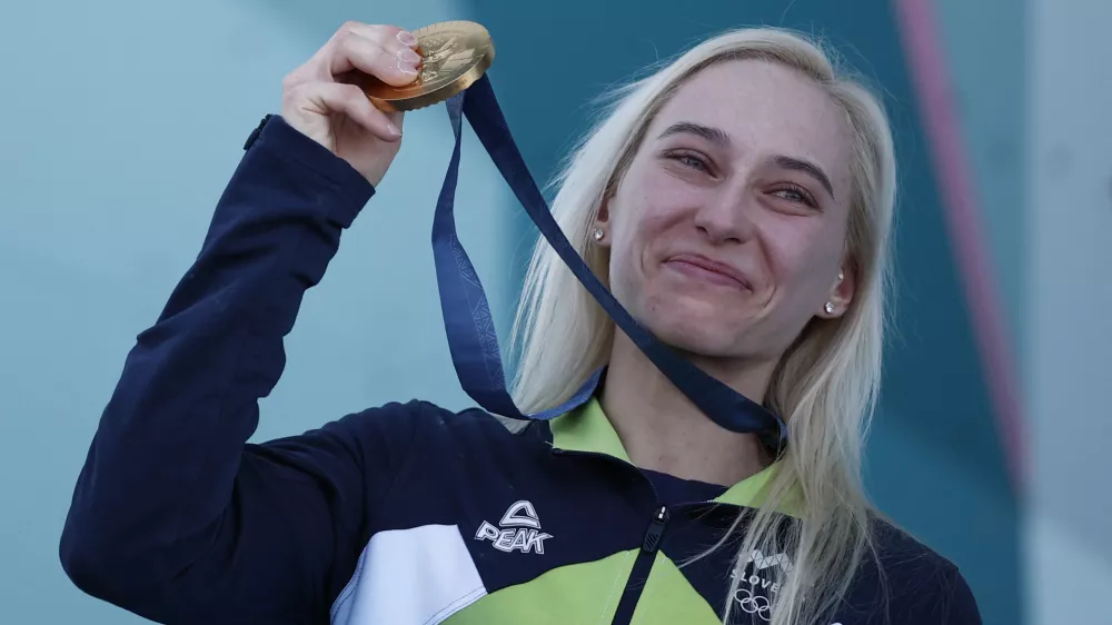 Paris 2024 Olympics - Climbing - Women's Boulder & Lead Victory Ceremony - Le Bourget Sport Climbing Venue, Le Bourget, France - August 10, 2024. Gold medallist Janja Garnbret of Slovenia celebrates on the podium. REUTERS/Benoit Tessier