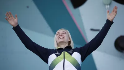 Paris 2024 Olympics - Climbing - Women's Boulder & Lead Victory Ceremony - Le Bourget Sport Climbing Venue, Le Bourget, France - August 10, 2024. Gold medallist Janja Garnbret of Slovenia celebrates on the podium. REUTERS/Benoit Tessier