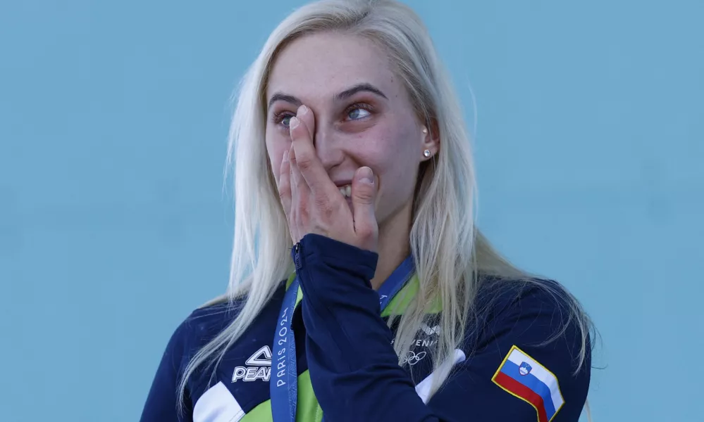 Paris 2024 Olympics - Climbing - Women's Boulder & Lead Victory Ceremony - Le Bourget Sport Climbing Venue, Le Bourget, France - August 10, 2024. Gold medallist Janja Garnbret of Slovenia celebrates on the podium. REUTERS/Anushree Fadnavis