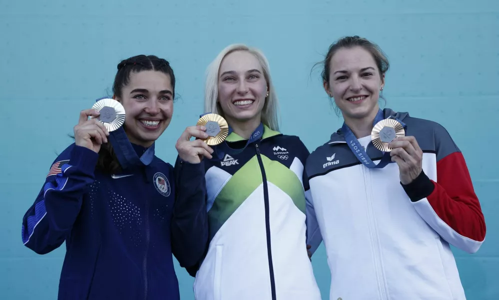 Paris 2024 Olympics - Climbing - Women's Boulder & Lead Victory Ceremony - Le Bourget Sport Climbing Venue, Le Bourget, France - August 10, 2024. Gold medallist Janja Garnbret of Slovenia, silver medallist Brooke Raboutou of United States and bronze medallist Jessica Pilz of Austria pose with medals. REUTERS/Benoit Tessier