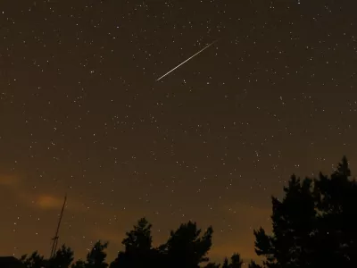 FILE - In this long exposure photo, a streak appears in the sky during the annual Perseid meteor shower at the Guadarrama mountains, near Madrid, in the early hours of Aug. 12, 2016. The best viewing for the annual shower visible around the world will be from Saturday night, Aug. 12, 2023, local time, into early Sunday morning, when viewers might be able to spot a meteor per minute. (AP Photo/Francisco Seco, File)