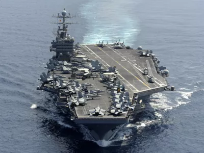 in this photo taken on Jan 18, 2012 and released by U.S. Navy, its aircraft carrier USS Abraham Lincoln transits the Indian Ocean. Amid heightened tensions with Iran, USS Abraham Lincoln sailed through the Strait of Hormuz into the Persian Gulf on Sunday, Jan. 22, 2012 without incident to conduct scheduled maritime security operations, the Navy said. (AP Photo/U.S. Navy, Chief Mass Communication Specialist Eric S. Powell) EDITORIAL USE ONLY