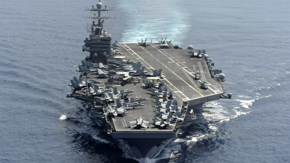 in this photo taken on Jan 18, 2012 and released by U.S. Navy, its aircraft carrier USS Abraham Lincoln transits the Indian Ocean. Amid heightened tensions with Iran, USS Abraham Lincoln sailed through the Strait of Hormuz into the Persian Gulf on Sunday, Jan. 22, 2012 without incident to conduct scheduled maritime security operations, the Navy said. (AP Photo/U.S. Navy, Chief Mass Communication Specialist Eric S. Powell) EDITORIAL USE ONLY