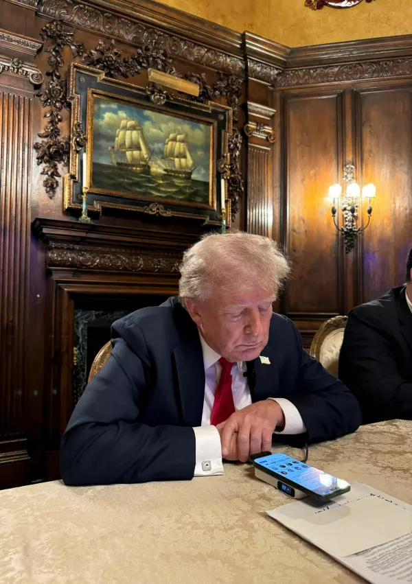 Republican presidential nominee and former U.S. President Donald Trump speaks as he participates in an interview with billionaire entrepreneur Elon Musk on the social media platform X, at Mar-a-Lago in Palm Beach, Florida, U.S., August 12, 2024 in this picture obtained from social media. Margo Martin via X/via REUTERS THIS IMAGE HAS BEEN SUPPLIED BY A THIRD PARTY. MANDATORY CREDIT. NO RESALES. NO ARCHIVES.