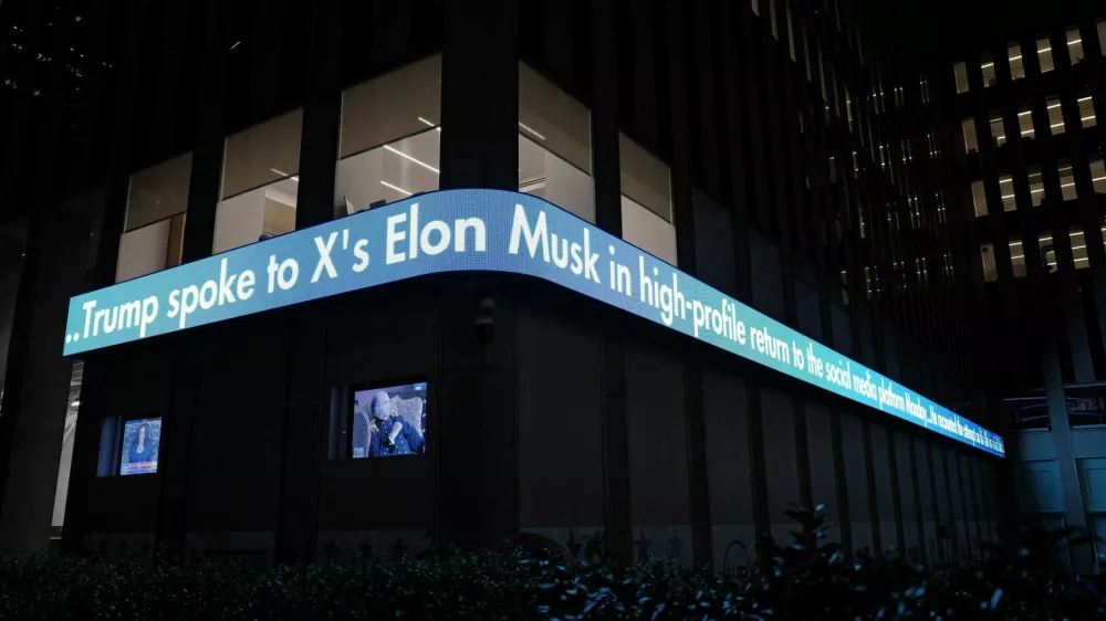 The Fox News ticker shows the news of Elon Musk's interview with Republican presidential candidate and former U.S. President Donald Trump on the X social media network, in New York City, U.S. August 12, 2024. REUTERS/Adam Gray