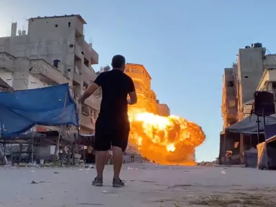 Flames rise following an Israeli strike on a residential building, amid the ongoing conflict between Israel and Hamas, in Gaza City, in this screen grab taken from a video, August 11, 2024. Reuters TV via REUTERS