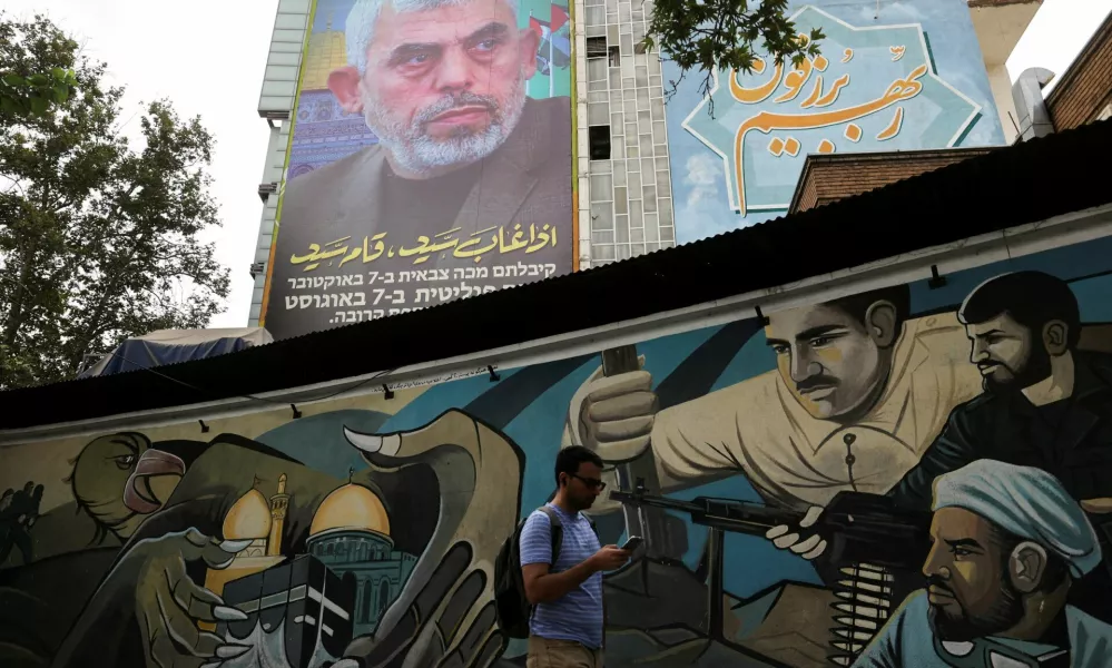 FILE PHOTO: A billboard with a picture of newly appointed Hamas leader Yahya Sinwar is displayed on a building in a street in Tehran, Iran, August 12, 2024. Majid Asgaripour/WANA (West Asia News Agency) via REUTERS ATTENTION EDITORS - THIS PICTURE WAS PROVIDED BY A THIRD PARTY/File Photo