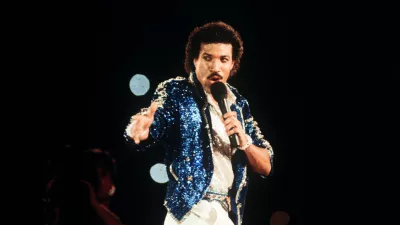 American singer Lionel Richie performing during the closing ceremony of the 1984 Los Angeles Summer Olympics. (Photo by S&G/PA Images via Getty Images)