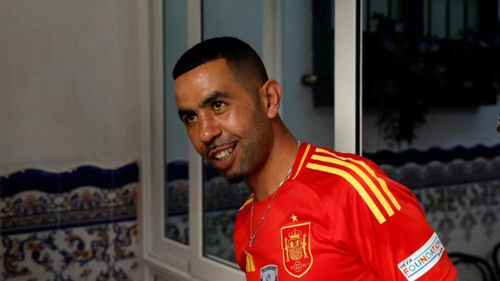 FILE PHOTO: Mounir Nasraoui, father of soccer player Lamine Yamal, smiles in Bar El Cordobes at Rocafonda neighbourhood in Mataro, north of Barcelona, Spain, July 11, 2024. REUTERS/ Albert Gea/File Photo