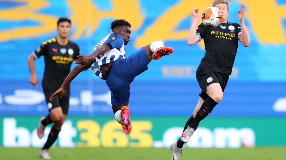 ﻿11 July 2020, England, Brighton: Brighton and Hove Albion's Yves Bissouma (L) challenges Manchester City's Kevin De Bruyne during the English Premier League soccer match between Brighton & Hove Albion and Manchester City at the Amex Stadium. Photo: Catherine Ivill/Nmc Pool/PA Wire/dpa