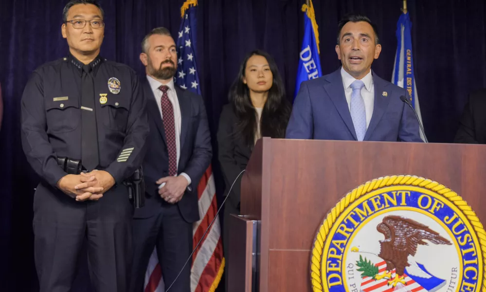 United States Attorney Martin Estrada, at podium, is joined by Los Angeles Police Chief Dominic Choi, far left, and other officials to announce court filings related to the death of actor Matthew Perry in Los Angeles on Thursday, Aug. 15, 2024. (AP Photo/Damian Dovarganes)