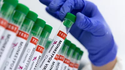 FILE PHOTO: Test tubes labelled "Monkeypox virus positive and negative" are seen in this illustration taken May 23, 2022. REUTERS/Dado Ruvic/Illustration/File Photo