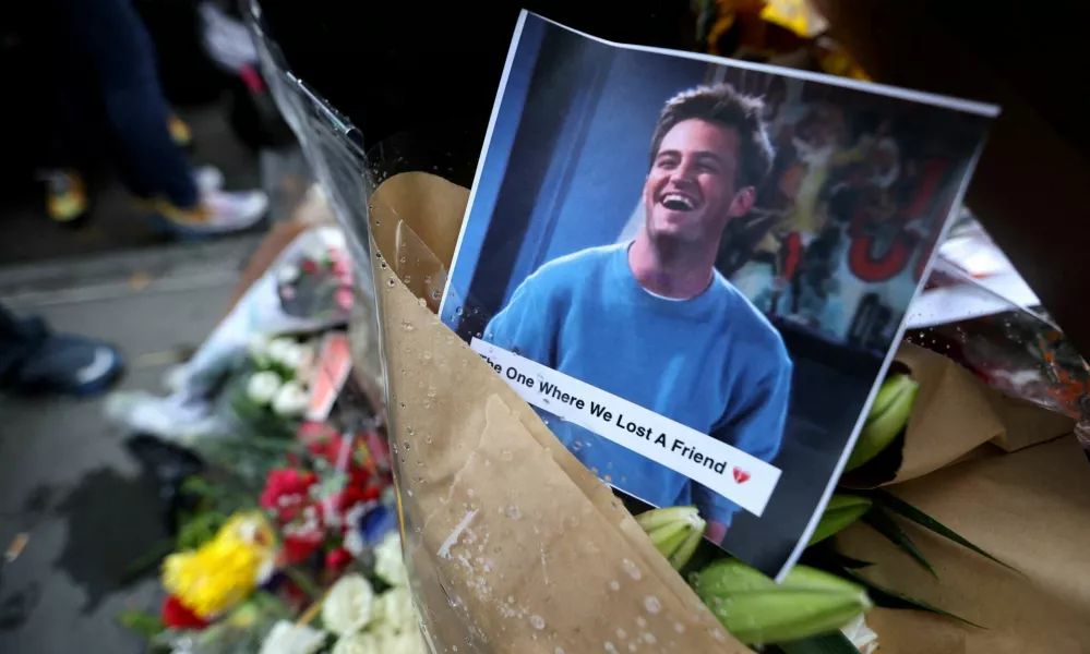 FILE PHOTO: A makeshift memorial for actor Matthew Perry, the wise-cracking co-star of the 1990s hit television sitcom "Friends," who was found dead at his Los Angeles home October 28, is pictured on Bedford Street in Manhattan in New York City, U.S., October 30, 2023. REUTERS/Mike Segar/File Photo