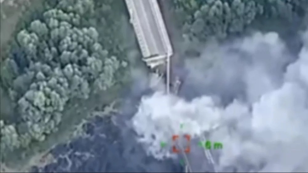 In this photo provided by the Ukrainian Defence Ministry Press Office, a strategically important bridge over the river Seym is destroyed by Ukrainian troops as they continue their incursion into the Kursk region, Russia, Friday, Aug. 16, 2024. The bridge was used by the Kremlin to supply its troops and its destruction could hamper their efforts. (Ukrainian Defence Ministry Press Office via AP)