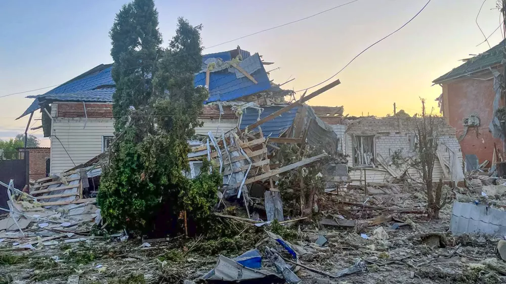 This photo released by the acting Governor of Kursk region Alexei Smirnov telegram channel on Tuesday, Aug. 6, 2024, shows a damaged house after shelling by the Ukrainian side in the city of Sudzha, Kursk region that borders Ukraine. Russian officials said Wednesday they were fighting off Ukrainian cross-border raids in a southwestern border province for a second day, as Kyiv officials remained quiet about the scope of the operation. (Governor of Kursk region telegram channel via AP)