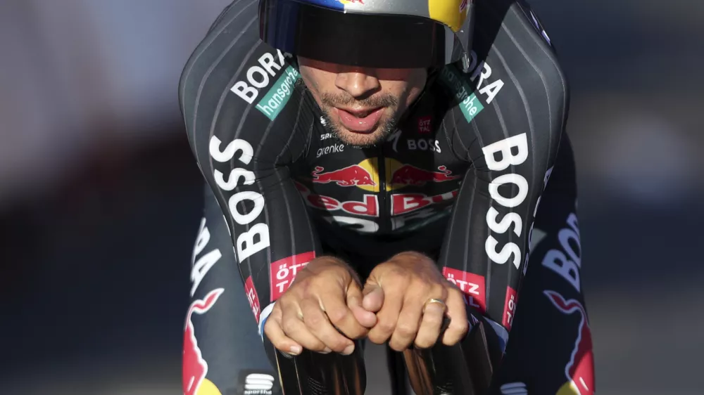 Primoz Roglic, of Slovenia, crosses the finish line in the first stage of the tour of Spain, La Vuelta, cycling race, an individual time trial with start in Lisbon and finish in Oeiras, Portugal, Saturday, Aug. 17, 2024. (AP Photo/Pedro Rocha)