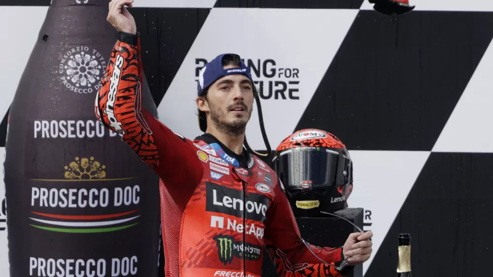 MotoGP - Austrian Grand Prix - Red Bull Ring, Spielberg, Austria - August 18, 2024 Ducati Lenovo Team's Francesco Bagnaia celebrates on the podium after winning the MotoGP REUTERS/Leonhard Foeger