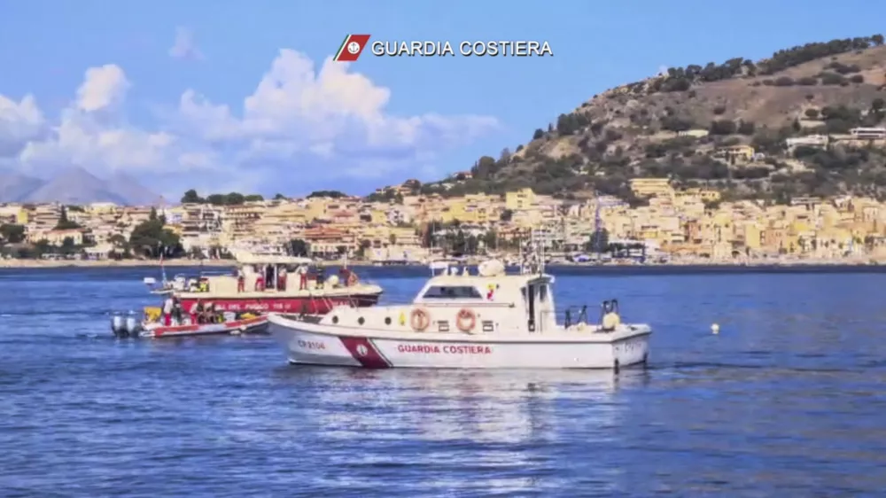 This picture taken from a video released by the Italian Coast Guard on Monday, Aug. 19, 2024, shows the rescue operations in the stretch of Sea near Palermo, Sicily, in southern Italy, where the sailing yacht Bayesian under the UK flag sank early Monday. (Italian Coast Guard via AP, HO)