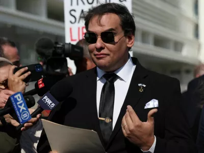 George Santos, who was expelled from the U.S. House of Representatives, reads a statement after pleading guilty to criminal corruption charges at Central Islip Federal Courthouse in Central Islip, New York, U.S., August 19, 2024. REUTERS/Shannon Stapleton