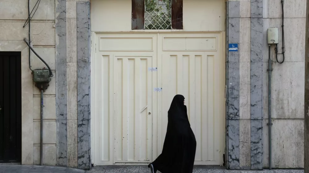 An Iranian woman passes in front of the German Language Institute of Tehran after it was closed by the Iranian police in Tehran, Iran, August 20, 2024. Majid Asgaripour/WANA (West Asia News Agency) via REUTERS ATTENTION EDITORS - THIS PICTURE WAS PROVIDED BY A THIRD PARTY