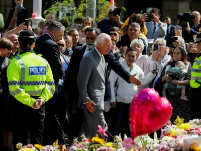 Britain's King Charles walks, as he makes a community visit, outside the Town Hall in Southport, Britain, August 20, 2024. REUTERS/Temilade Adelaja