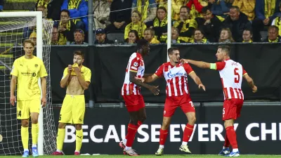 Belgrade's Ognjen Mimovic celebrates after scoring his side's first goal during the Champions League first leg play-off match between Bodø/Glimt and Crvena Zvezda (Red Star Belgrade) at the Aspmyra stadium in Bodø, Norway, Tuesday, Aug. 20, 2024. (Mats Torbergsen/NTB Scanpix via AP)