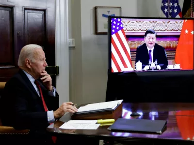 FILE PHOTO: U.S. President Joe Biden speaks virtually with Chinese leader Xi Jinping from the White House in Washington, U.S. November 15, 2021. REUTERS/Jonathan Ernst/File Photo