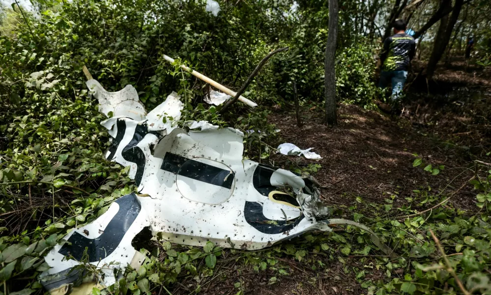 Rescue workers search the wreckage of a small aircraft a day after it crashed as five tourists from China and four Thais, including the two pilots, all presumed dead, in Bang Pakong, Chachoengsao province, Thailand, August 23, 2024. REUTERS/Patipat Janthong