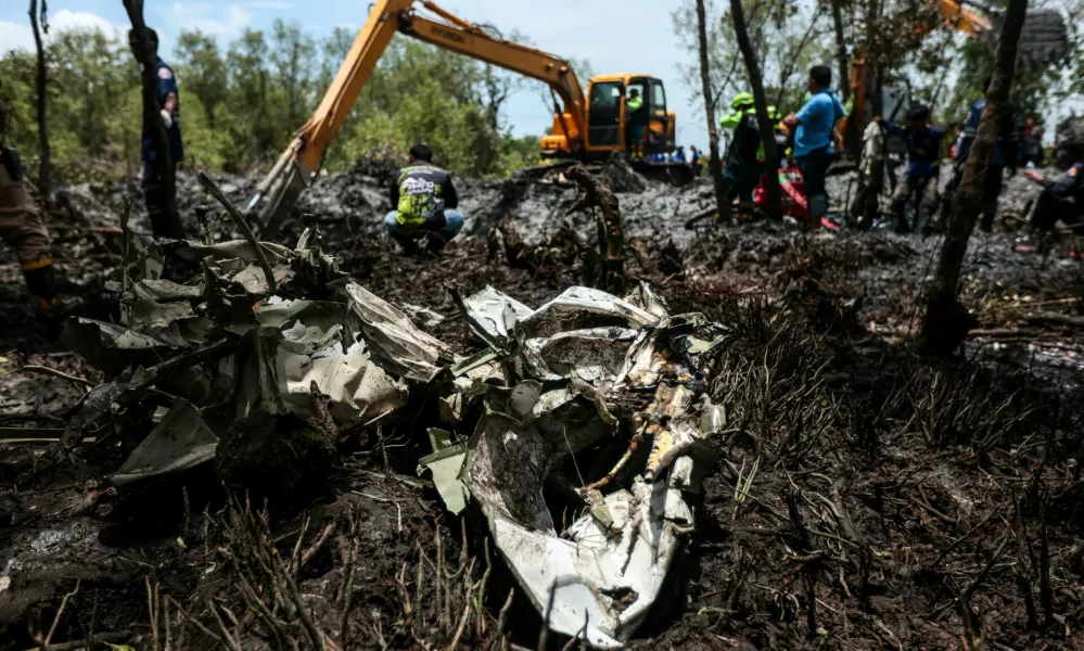 Rescue workers search the wreckage of a small aircraft a day after it crashed as five tourists from China and four Thais, including the two pilots, all presumed dead, in Bang Pakong, Chachoengsao province, Thailand, August 23, 2024. REUTERS/Patipat Janthong