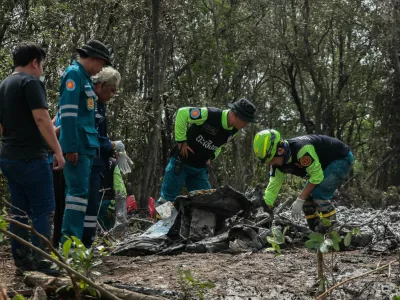 Rescue workers search the wreckage of a small aircraft a day after it crashed as five tourists from China and four Thais, including the two pilots, all presumed dead, in Bang Pakong, Chachoengsao province, Thailand, August 23, 2024. REUTERS/Patipat Janthong