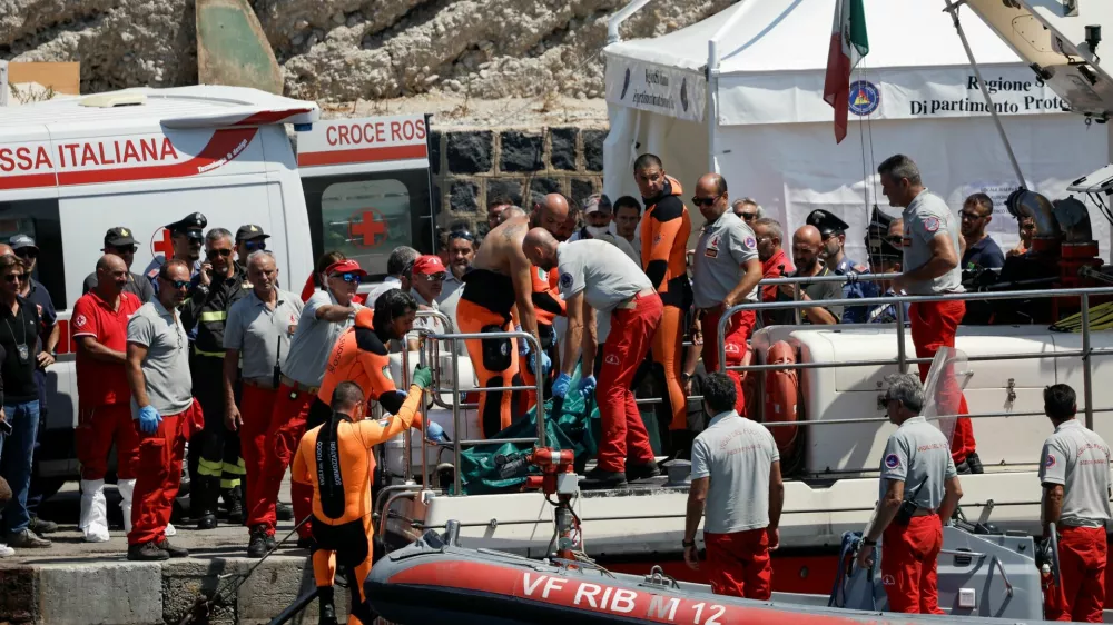 Rescue personnel move what is believed to be the body of Hannah Lynch, daughter of British tech entrepreneur Mike Lynch, at the scene where a luxury yacht sank, off the coast of Porticello, near the Sicilian city of Palermo, Italy, August 23, 2024. REUTERS/Louiza Vradi