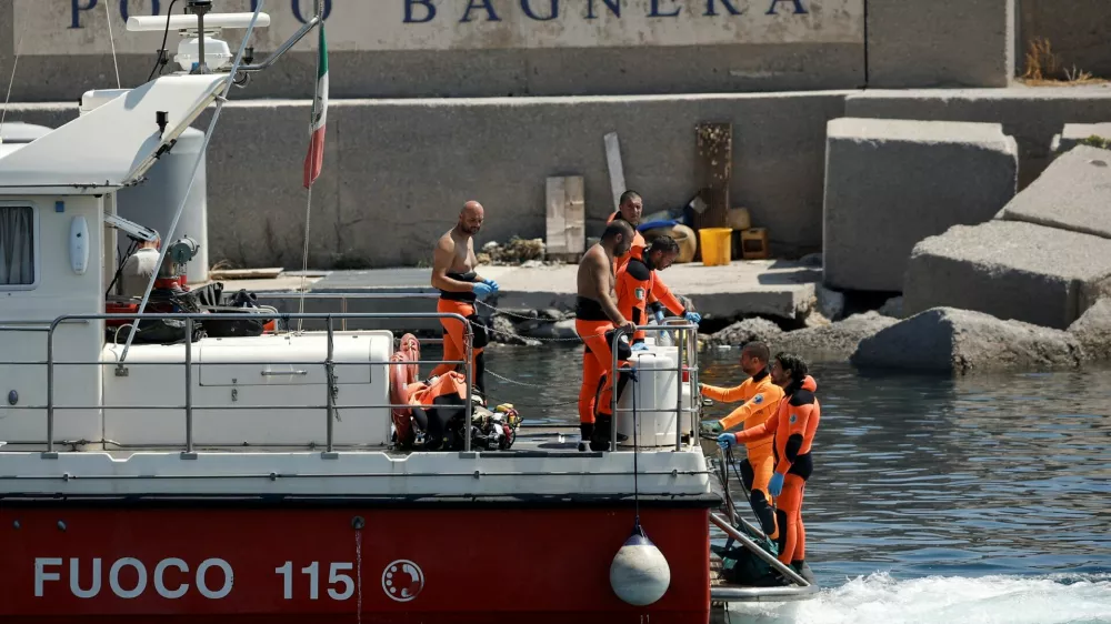 Rescue personnel transport what is believed to be the body of Hannah Lynch, daughter of British tech entrepreneur Mike Lynch, at the scene where a luxury yacht sank, off the coast of Porticello, near the Sicilian city of Palermo, Italy, August 23, 2024. REUTERS/Louiza Vradi