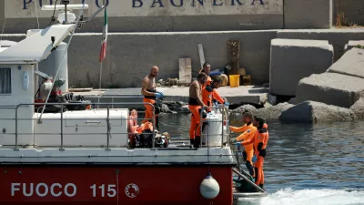 Rescue personnel transport what is believed to be the body of Hannah Lynch, daughter of British tech entrepreneur Mike Lynch, at the scene where a luxury yacht sank, off the coast of Porticello, near the Sicilian city of Palermo, Italy, August 23, 2024. REUTERS/Louiza Vradi